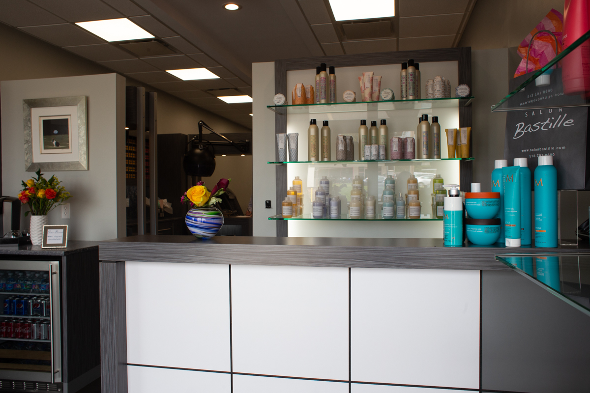 The front desk and retail shelves inside Salon Bastille, a family hair salon on Montgomery Road in Cincinnati